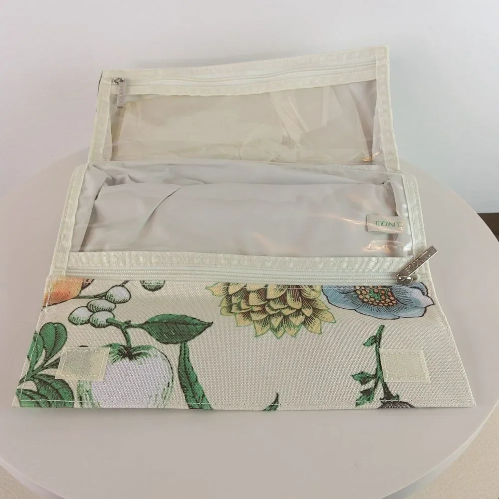 Clinique cream floral print fold over makeup / jewelry bag.